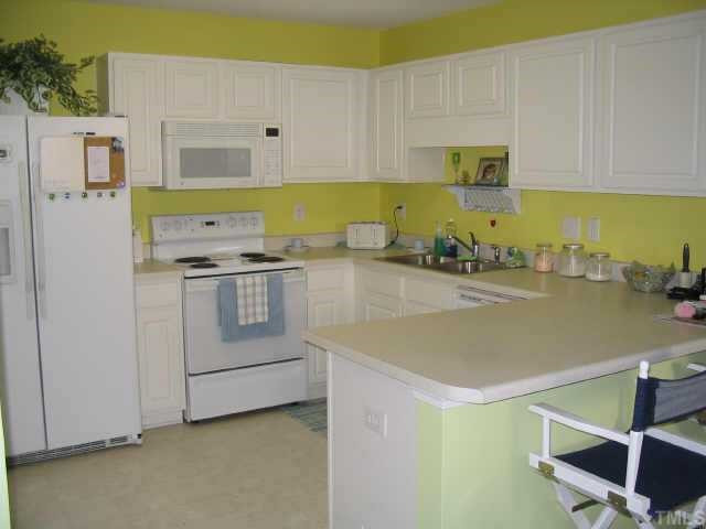 7213 Lowell Ridge Road Raleigh, NC 27616 - Photo 4 of 10 light and bright kitchen will convey with all major appliances, stove, dishwasher, refrigerator, washer & dryer Other