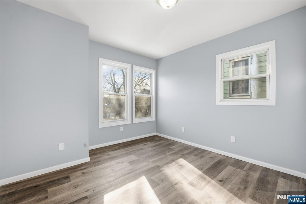 38 Mapes Avenue Newark, NJ 07112 - Photo 14 of 27 a view of an empty room with a window