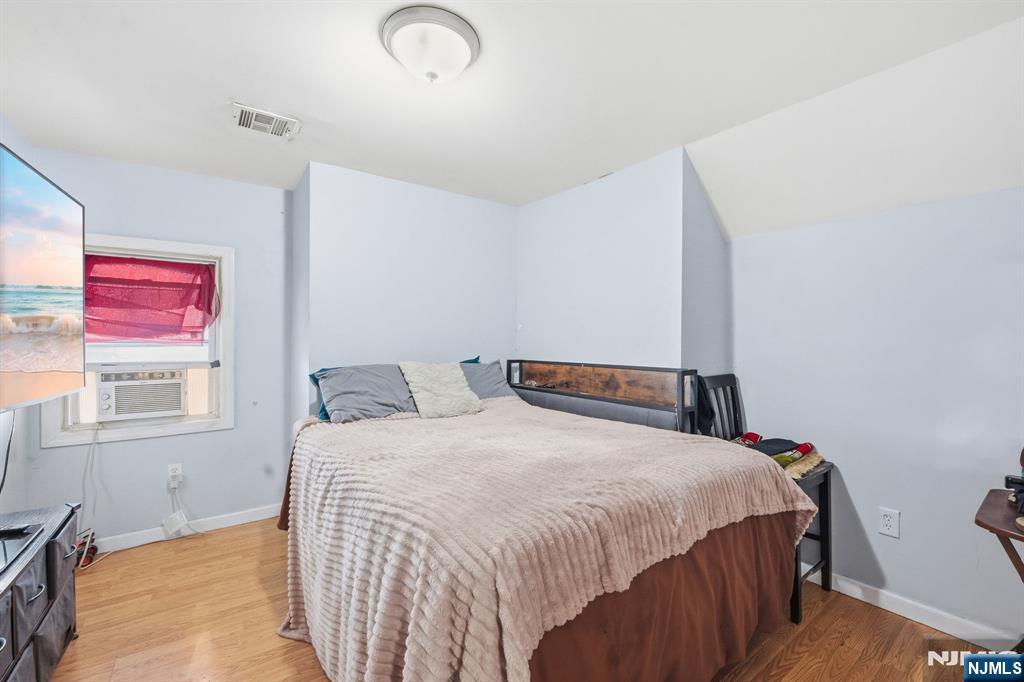 38 Mapes Avenue Newark, NJ 07112 - Photo 25 of 27 a bedroom with a bed and a window