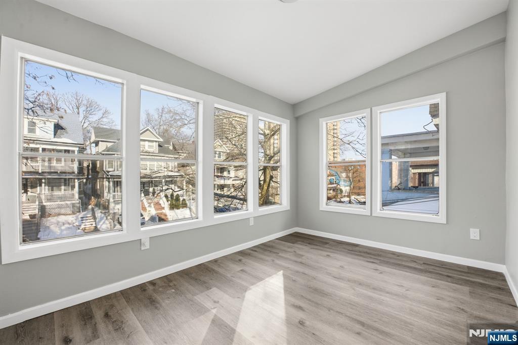 38 Mapes Avenue Newark, NJ 07112 - Photo 7 of 27 a view of an empty room with a window