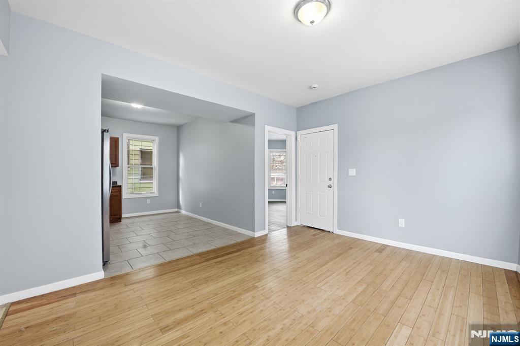 38 Mapes Avenue Newark, NJ 07112 - Photo 10 of 27 a view of an empty room with wooden floor