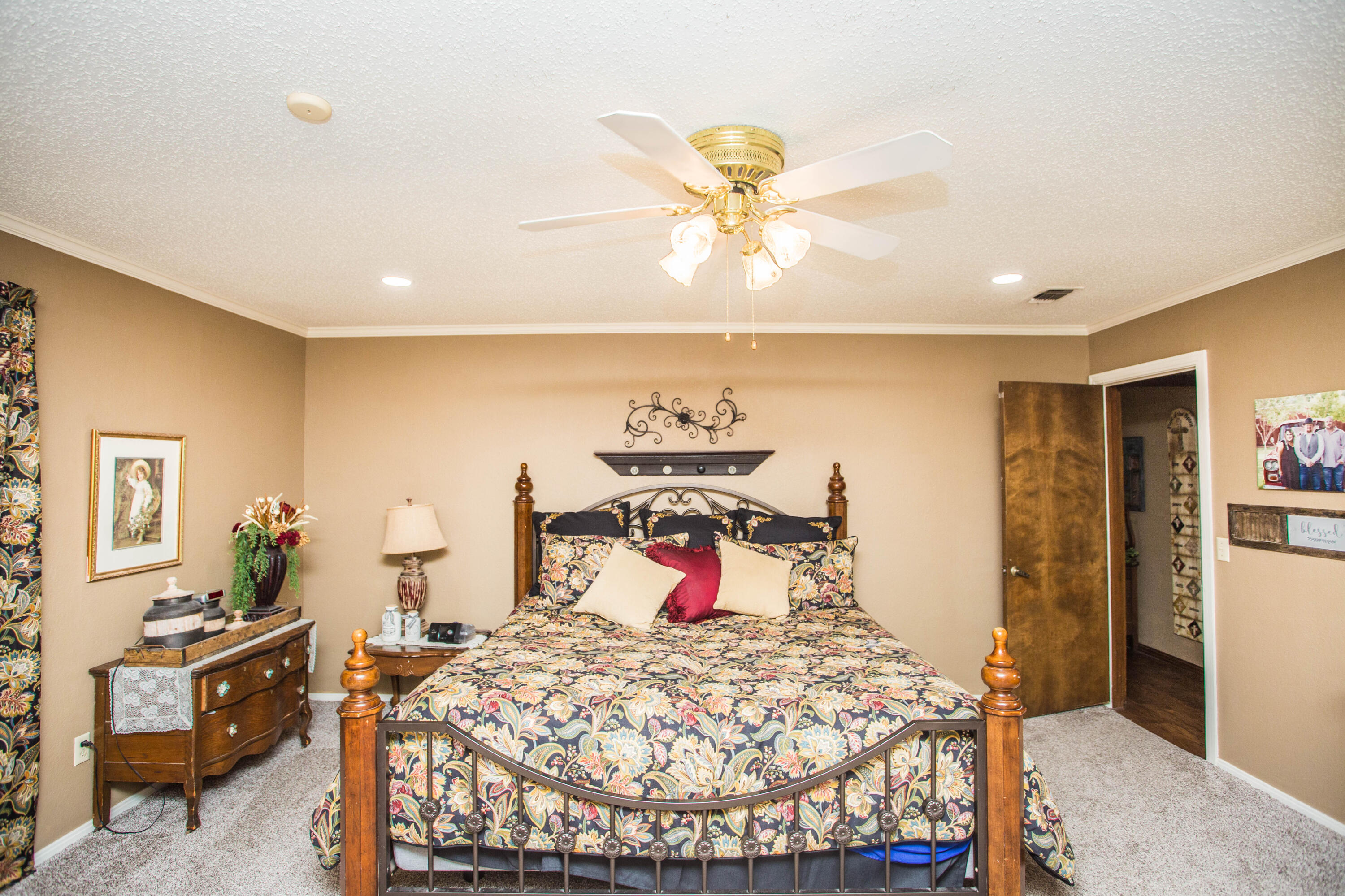 1304 Jefferson Drive Plainview, TX 79072 - Photo 16 of 50 a bed room with a bed and a chandelier