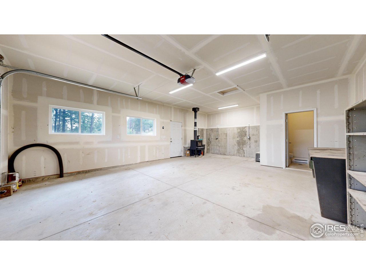 922 Easton Road Lyons, CO 80540 - Photo 25 of 38 Shop includes wood burning stove and bathroom