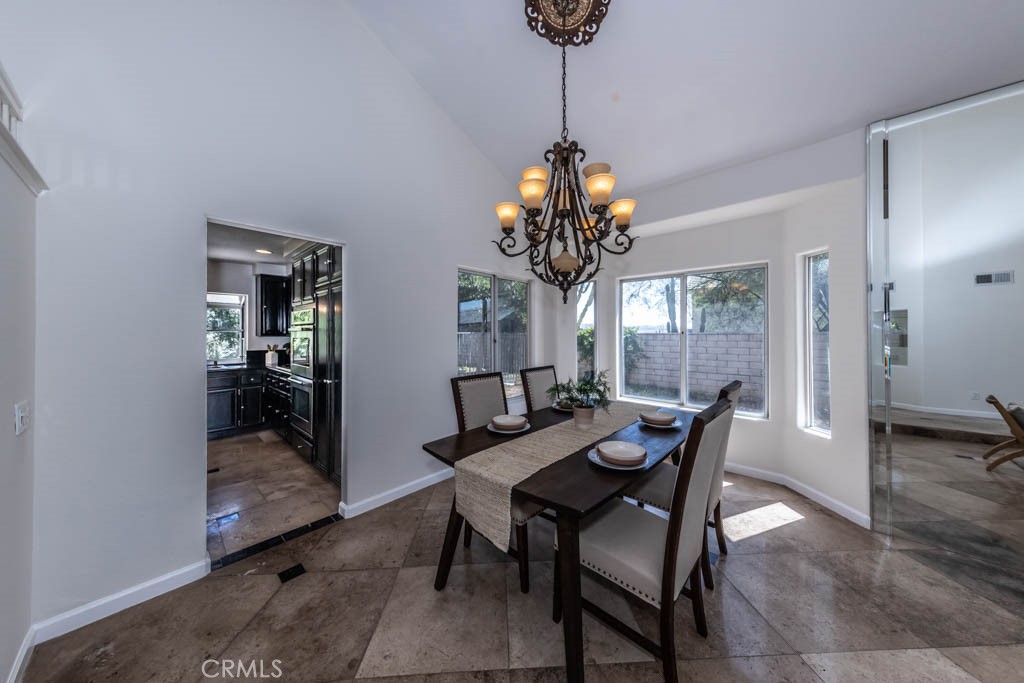 1881 Duncan Way Corona, CA 92881 - Photo 12 of 75 a view of a dining room with furniture and chandelier