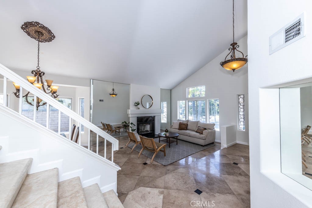 1881 Duncan Way Corona, CA 92881 - Photo 15 of 75 a living room with furniture and a chandelier