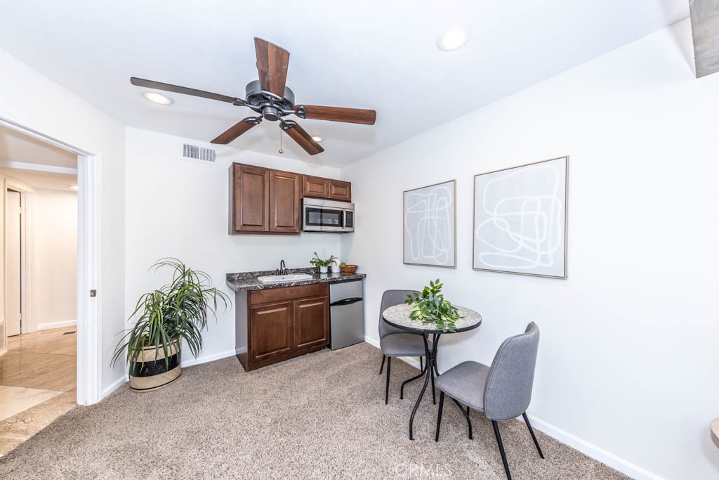 1881 Duncan Way Corona, CA 92881 - Photo 22 of 75 a kitchen with a refrigerator and a stove