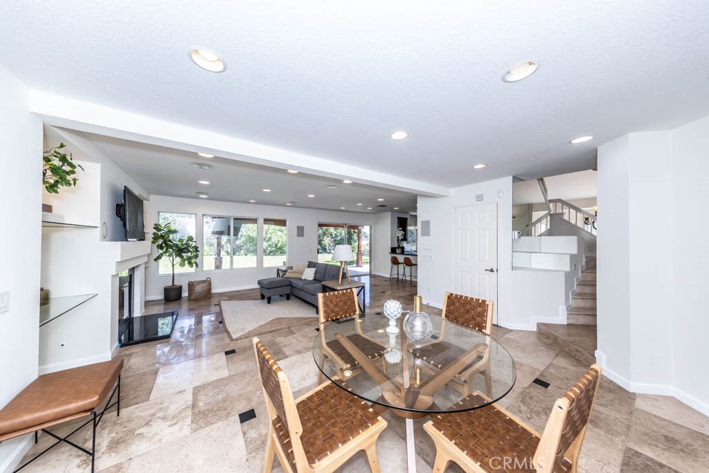 1881 Duncan Way Corona, CA 92881 - Photo 27 of 75 a living room with fireplace furniture and a large window