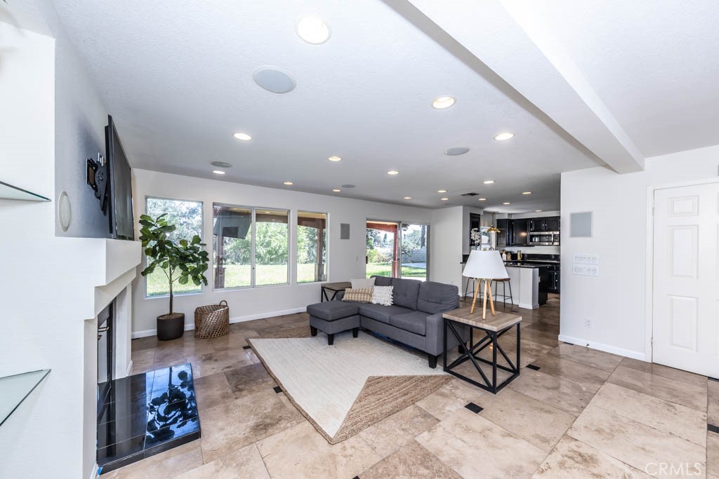 1881 Duncan Way Corona, CA 92881 - Photo 28 of 75 a living room with furniture and a large window