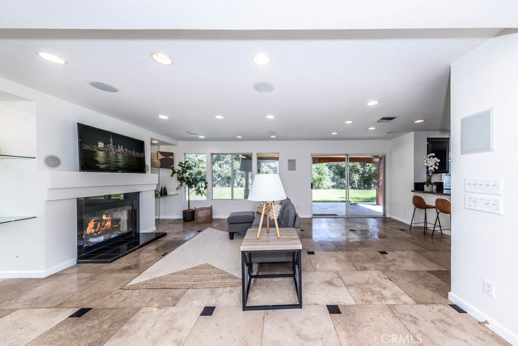 1881 Duncan Way Corona, CA 92881 - Photo 30 of 75 a living room with furniture and a fireplace