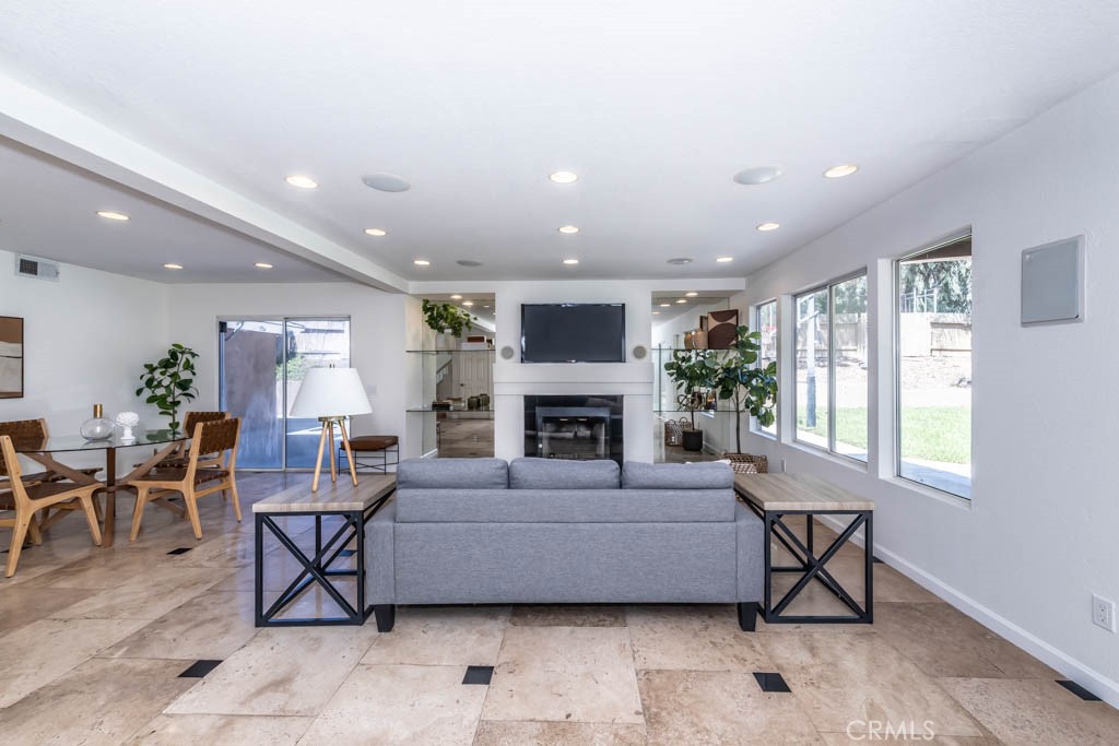 1881 Duncan Way Corona, CA 92881 - Photo 33 of 75 a living room with furniture a fireplace and a table
