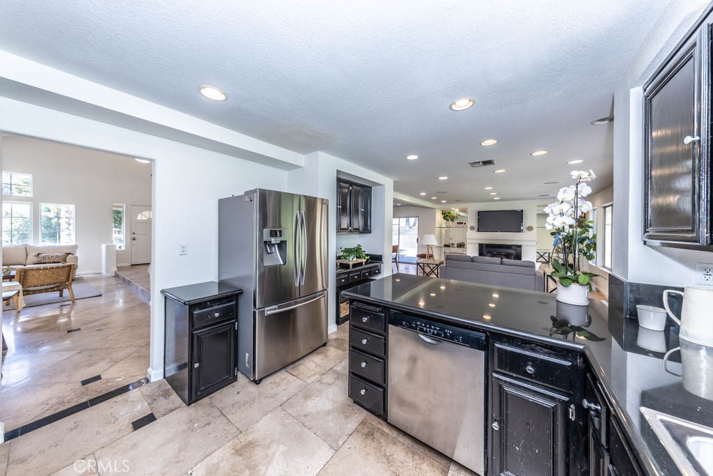 1881 Duncan Way Corona, CA 92881 - Photo 39 of 75 a kitchen with stainless steel appliances granite countertop a sink and a refrigerator