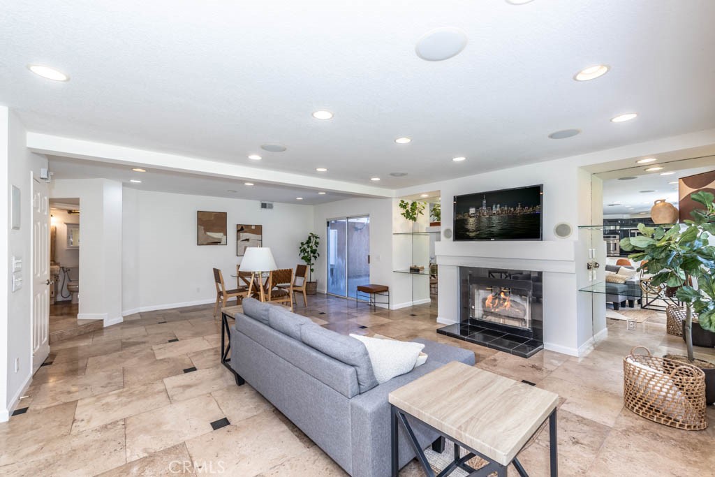 1881 Duncan Way Corona, CA 92881 - Photo 40 of 75 a living room with furniture and a fireplace