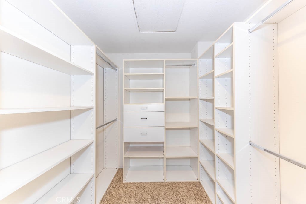 1881 Duncan Way Corona, CA 92881 - Photo 50 of 75 a view of walk in closet with empty racks