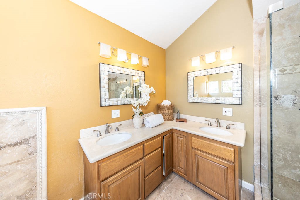 1881 Duncan Way Corona, CA 92881 - Photo 52 of 75 a bathroom with a sink and a mirror