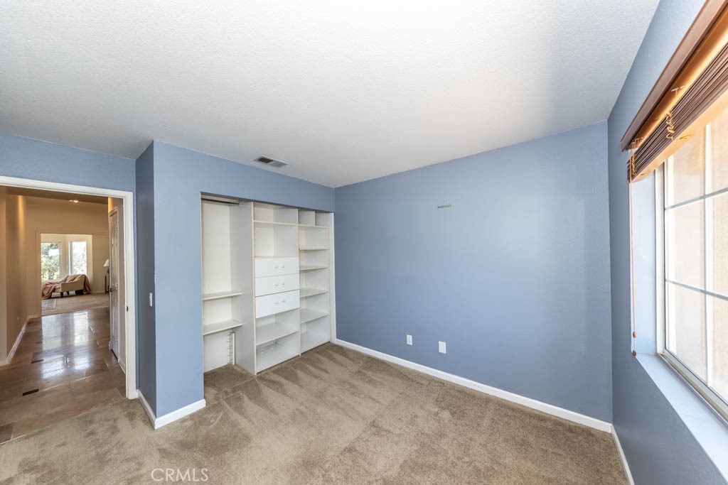 1881 Duncan Way Corona, CA 92881 - Photo 64 of 75 an empty room with windows and closet