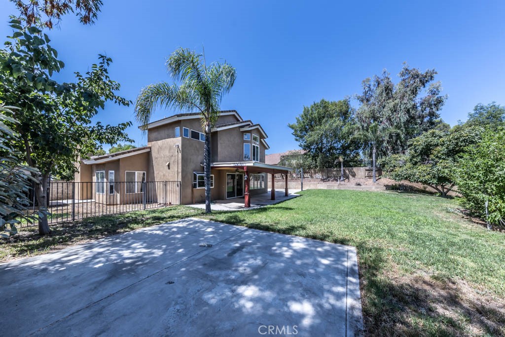 1881 Duncan Way Corona, CA 92881 - Photo 69 of 75 a front view of a house with a yard and garage