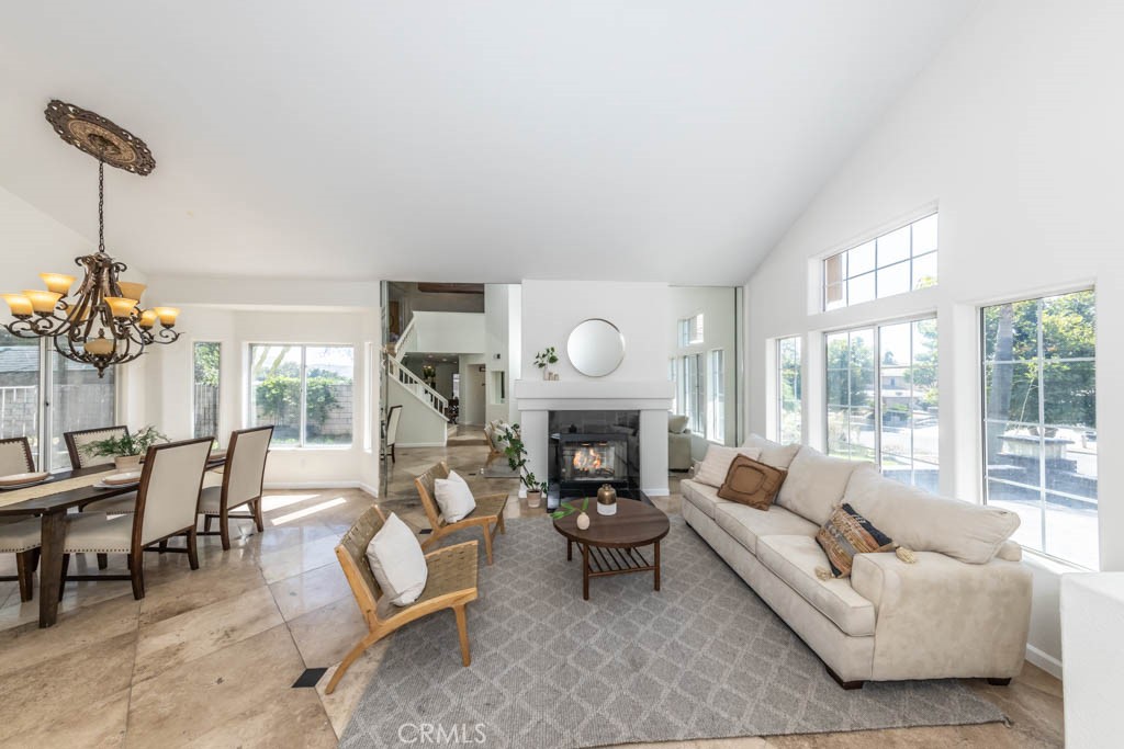 1881 Duncan Way Corona, CA 92881 - Photo 8 of 75 a living room with furniture a fireplace and a large window
