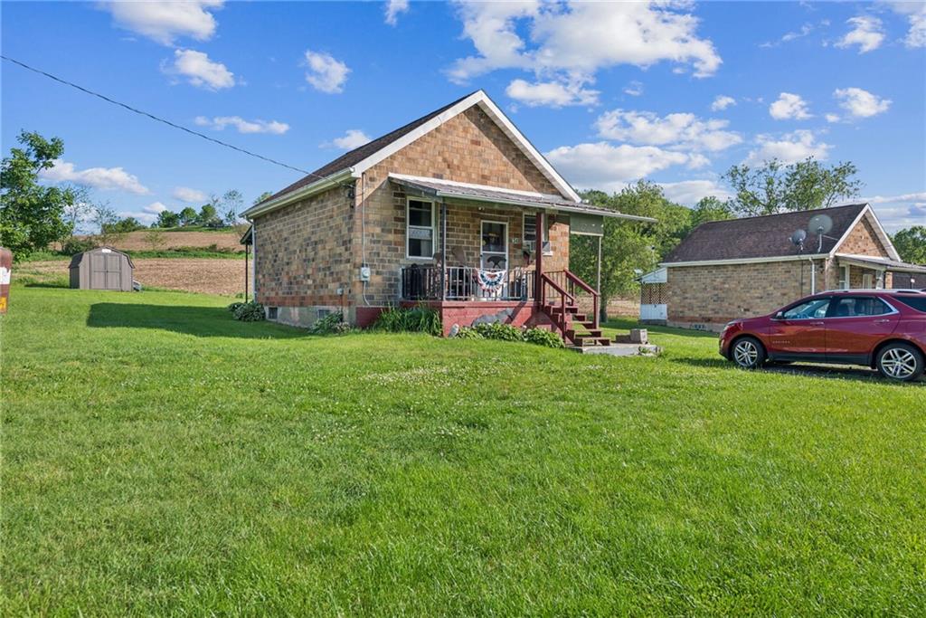 375 Reduction Road Smithton, PA 15479 - Photo 16 of 30 a view of a house with a yard