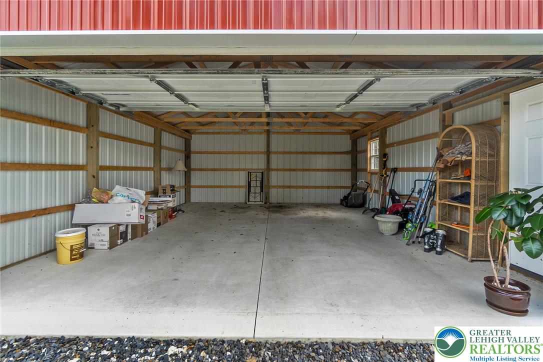 506 Richmond Road Bangor, PA 18013 - Photo 6 of 43 A spacious outbuilding features concrete flooring, exposed wood trusses, and high ceilings.
