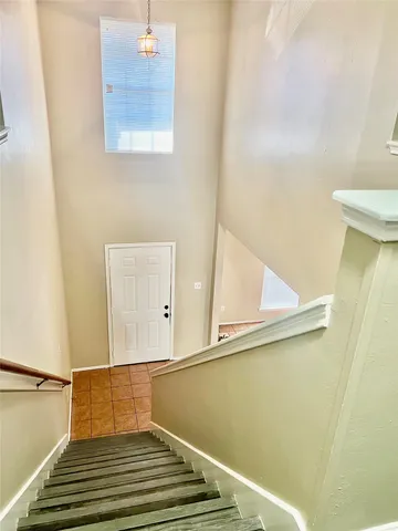a view of a balcony with wooden floor