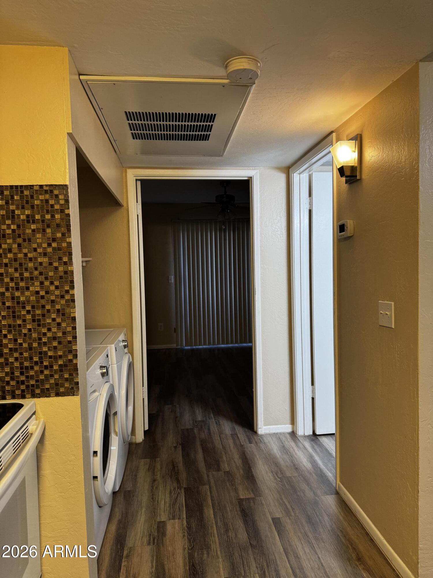 12123 West Bell Road, Unit 258 Surprise, AZ 85378 - Photo 8 of 30 a view of a entryway door with wooden floor