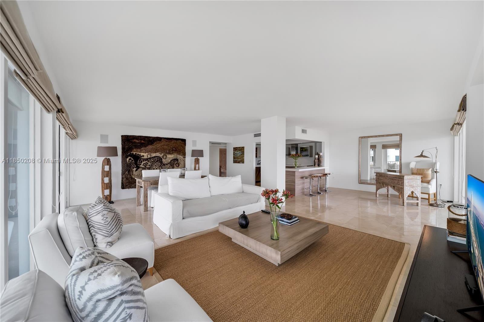 199 Ocean Ln Drive, Unit 901 Key Biscayne, FL 33149 - Photo 12 of 31 a living room with furniture and a table