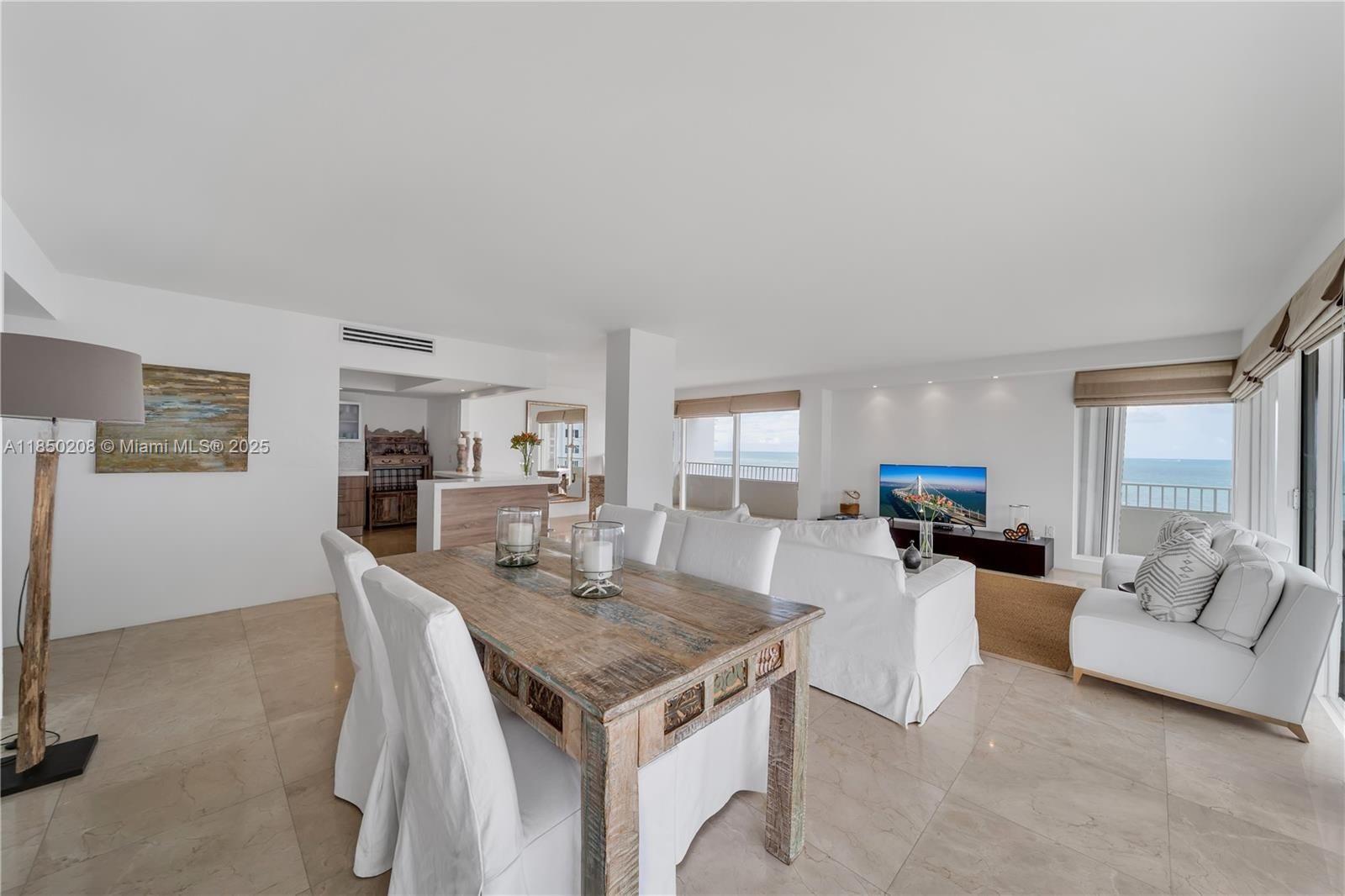 199 Ocean Ln Drive, Unit 901 Key Biscayne, FL 33149 - Photo 15 of 31 a living room with furniture and a table