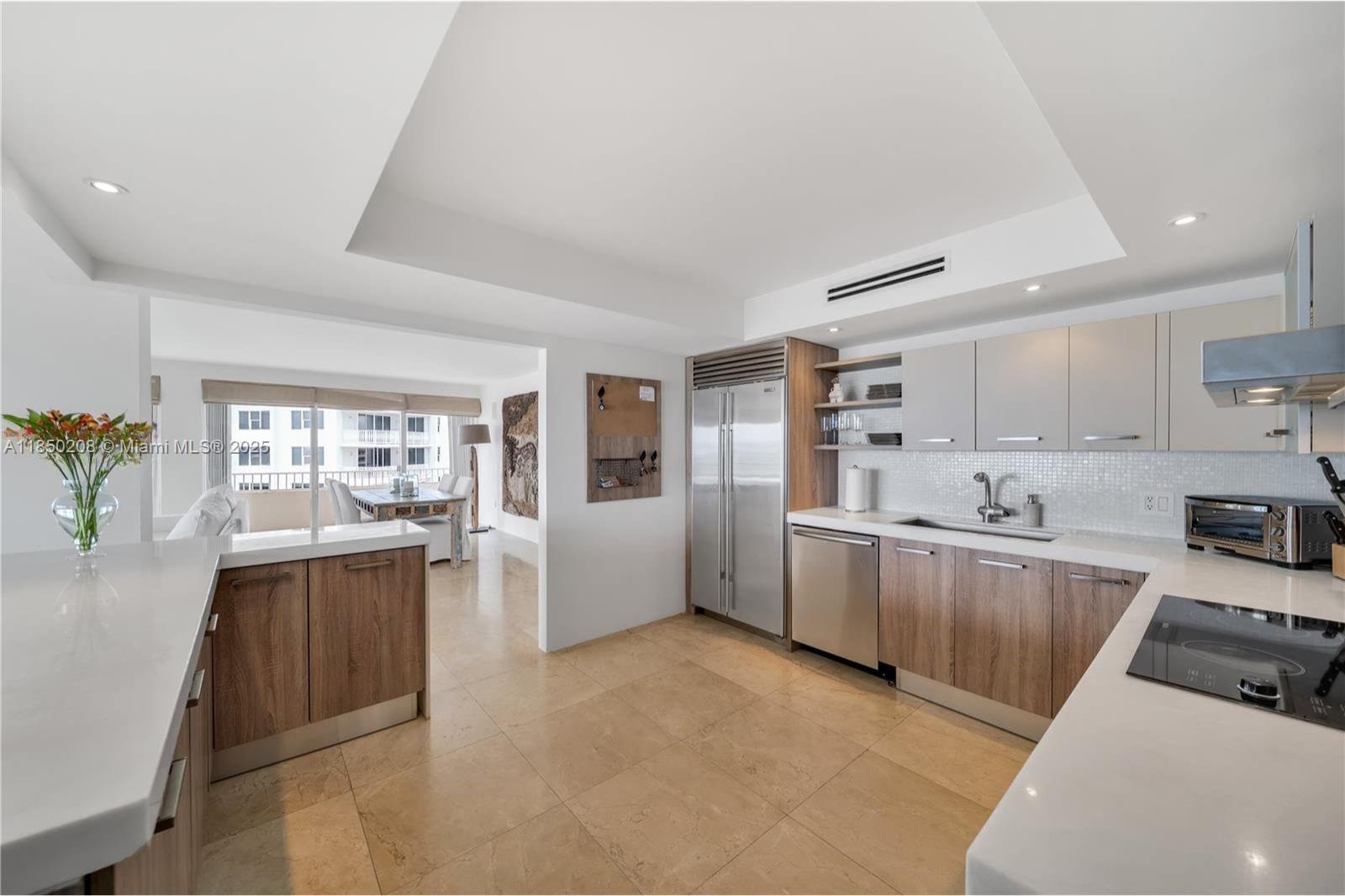 199 Ocean Ln Drive, Unit 901 Key Biscayne, FL 33149 - Photo 17 of 31 a large white kitchen with stainless steel appliances lots of counter top space