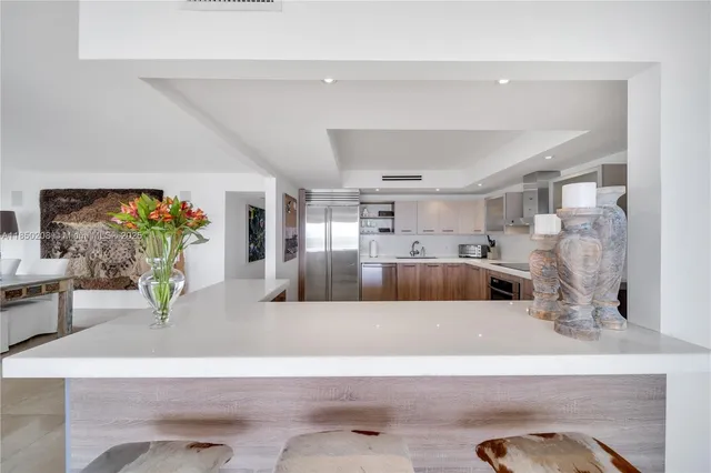 a view of living room and kitchen with furniture