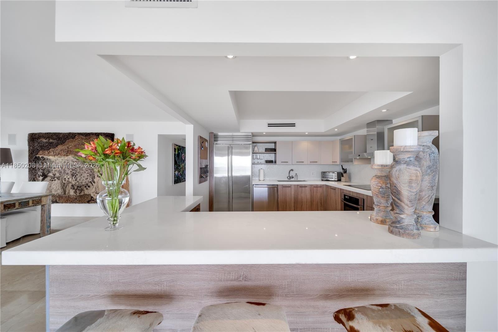 199 Ocean Ln Drive, Unit 901 Key Biscayne, FL 33149 - Photo 19 of 31 a living room with furniture and a flat screen tv