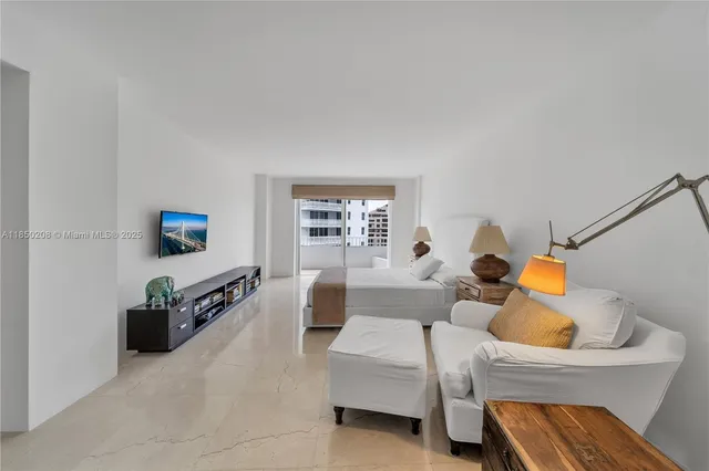 a bedroom with two beds and a couch