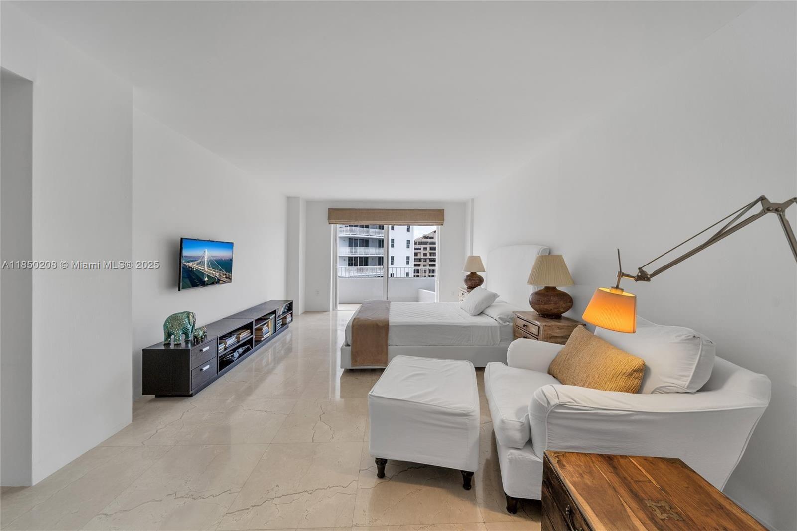 199 Ocean Ln Drive, Unit 901 Key Biscayne, FL 33149 - Photo 23 of 31 a living room with furniture and a flat screen tv