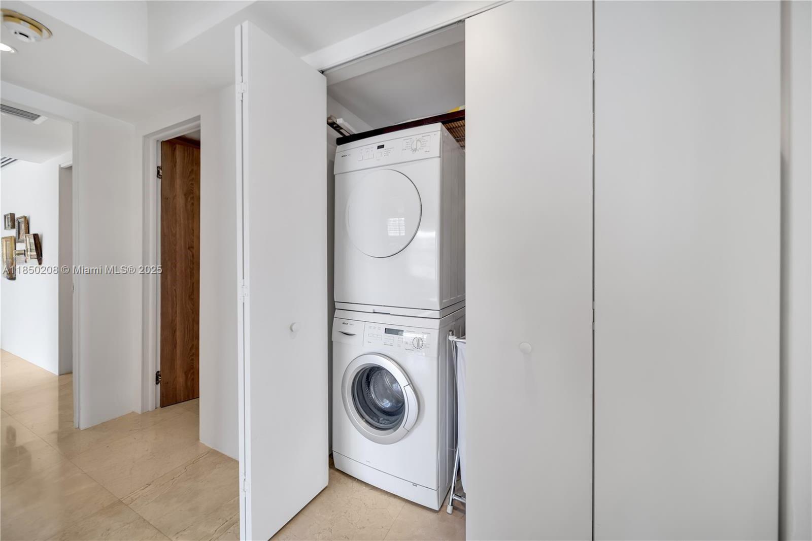 199 Ocean Ln Drive, Unit 901 Key Biscayne, FL 33149 - Photo 27 of 31 a utility room with dryer and washer