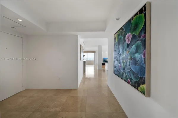 a view of a hallway with wooden shelves