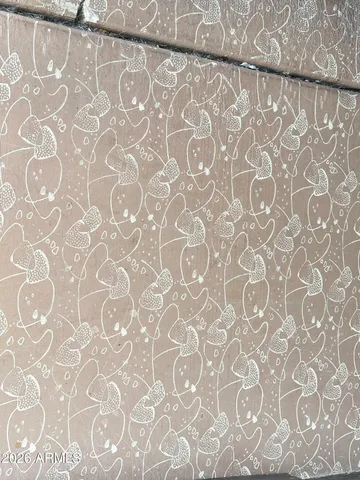 a living room with furniture floor to ceiling window and a flat screen tv