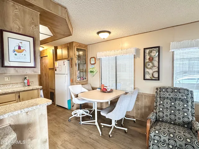 a kitchen with stainless steel appliances kitchen island granite countertop a sink and cabinets