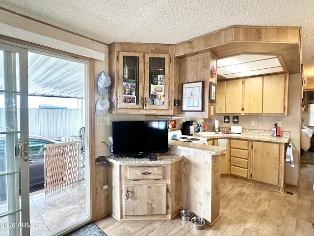 a kitchen that has a sink a stove and a window