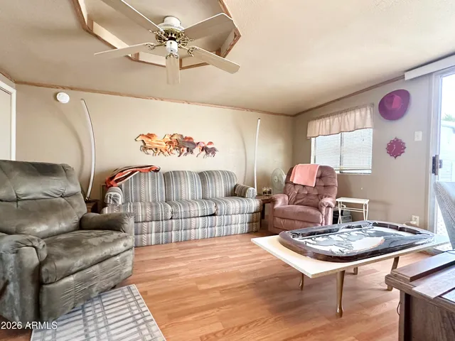 a living room with furniture and a window
