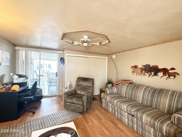 a living room with furniture and a rug