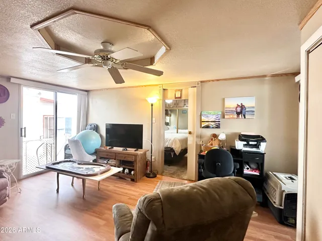 a bathroom with a sink a toilet and shower curtain