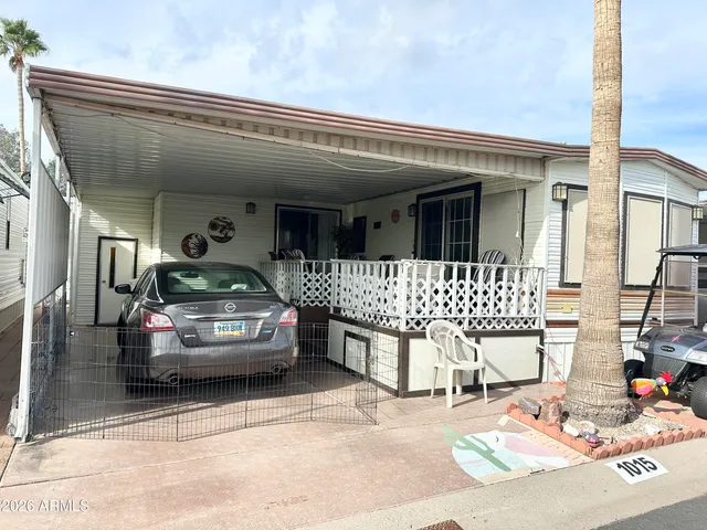 a view of a chairs and table in the balcony
