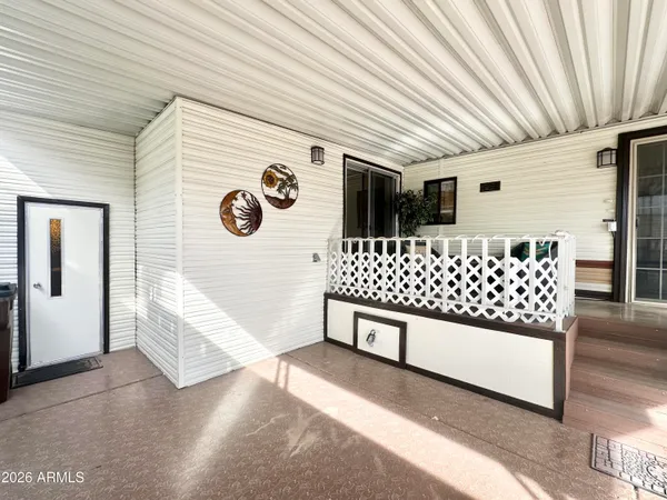 a view of balcony with wooden floor