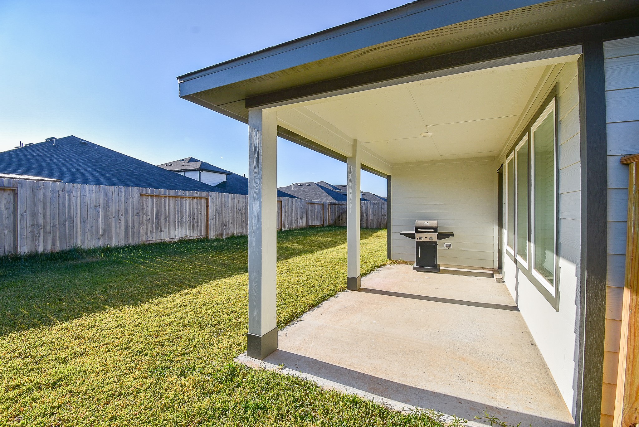 2827 Bur Lndg Lane Rosenberg, TX 77469 - Photo 19 of 20 a bedroom with a bed and a view of the house