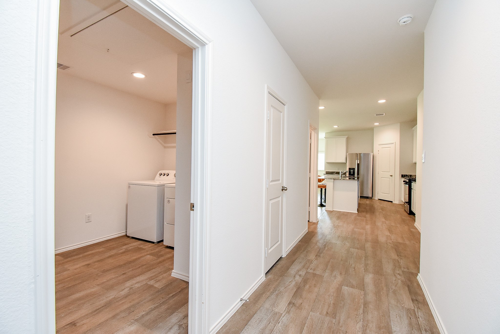 2827 Bur Lndg Lane Rosenberg, TX 77469 - Photo 4 of 20 a view of a kitchen with a refrigerator and a stove top oven