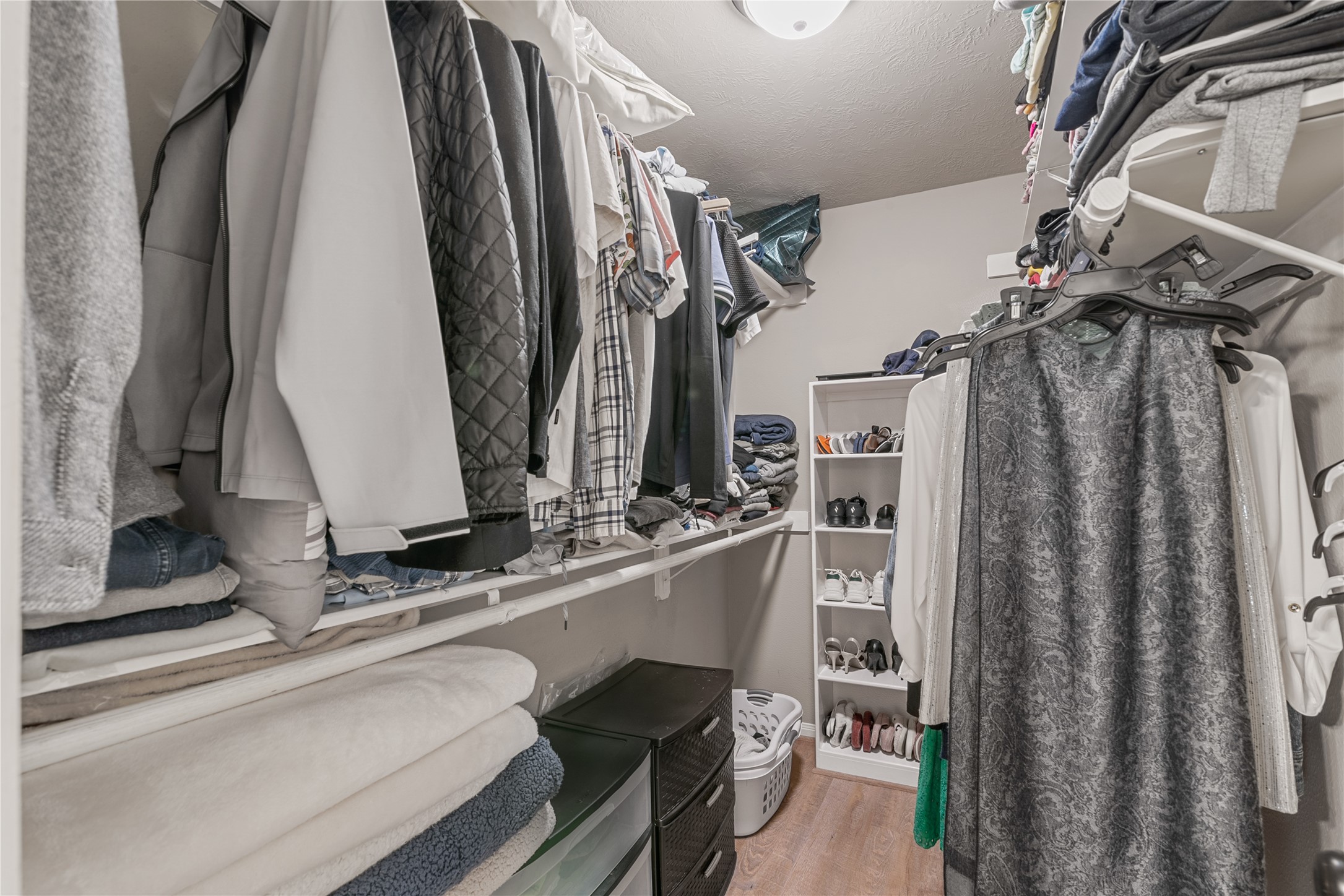 31203 Baker Lake Drive Spring, TX 77386 - Photo 19 of 24 The spacious walk-in closet offers abundant hangind rods and generous shelving, providing excellent storage and organization.