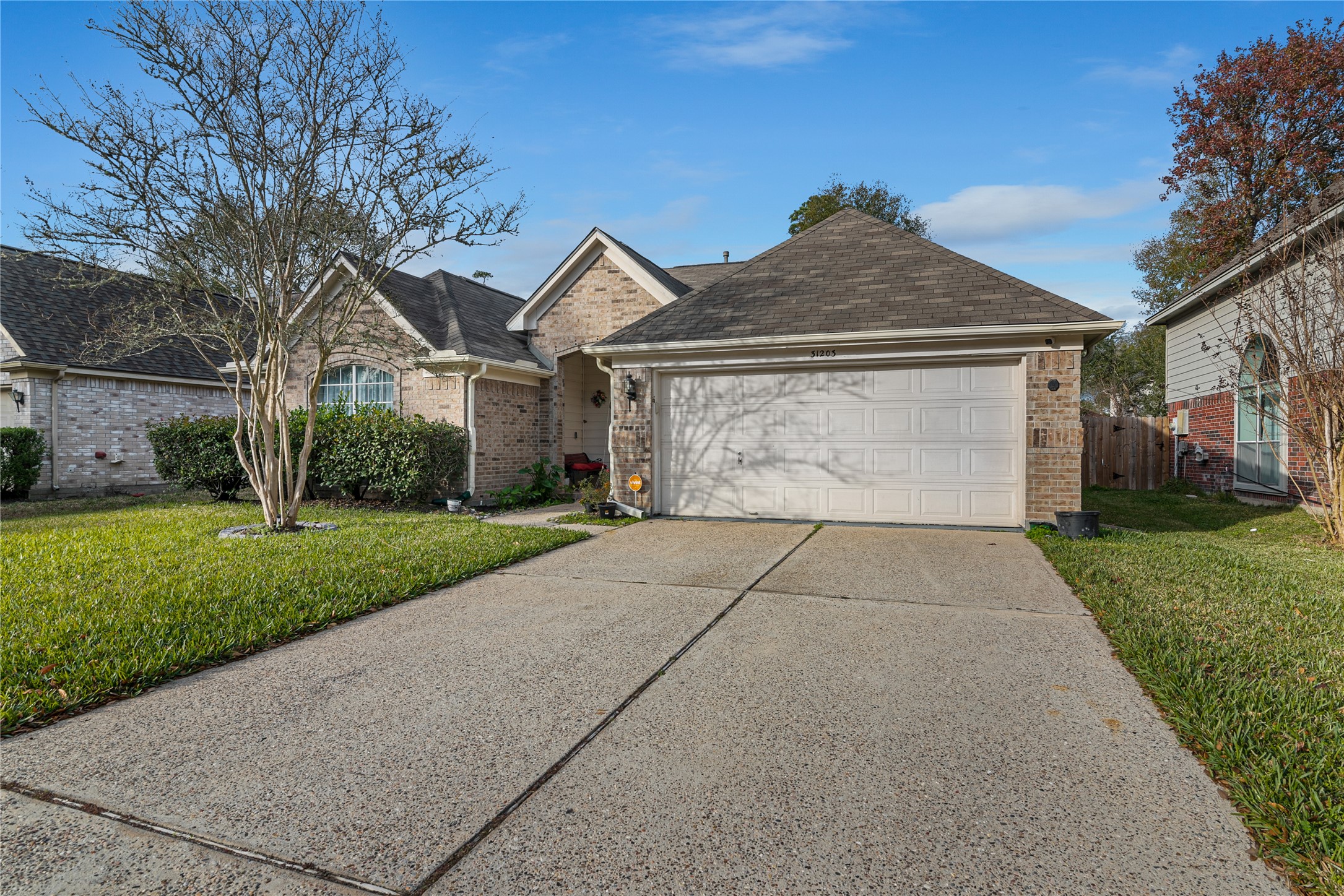 31203 Baker Lake Drive Spring, TX 77386 - Photo 2 of 24 Another perspective of the front of the home featuring the driveway, offering convenient additional parking .