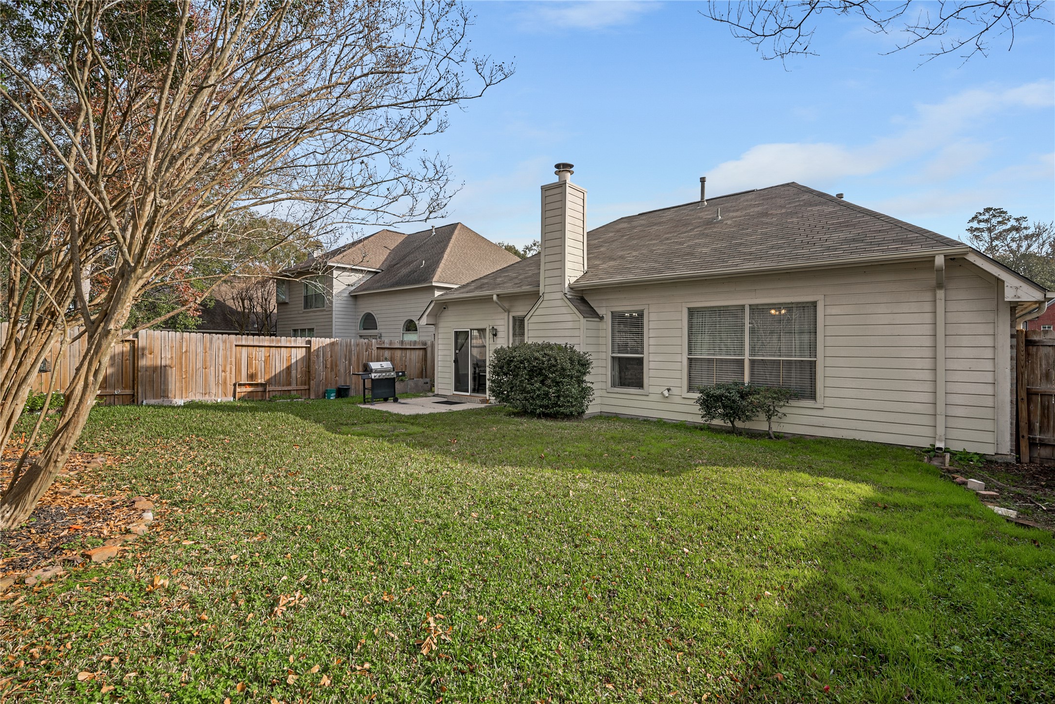 31203 Baker Lake Drive Spring, TX 77386 - Photo 23 of 24 Step outside to a spacious backyard, ideal for entertaining, gatherings and outdoor enjoyment.