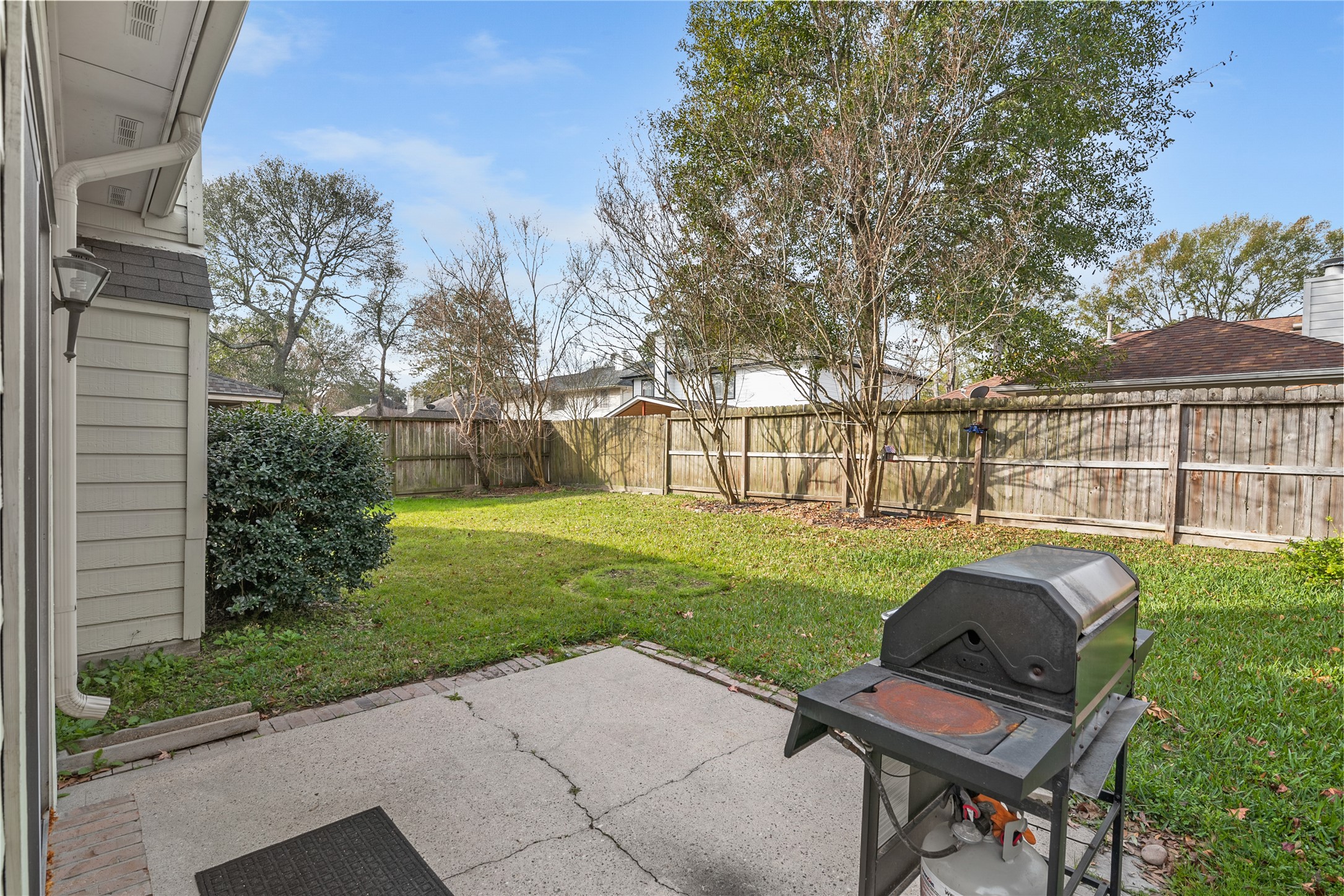31203 Baker Lake Drive Spring, TX 77386 - Photo 24 of 24 Enjoy your weekends in this generously sized backyard, perfect for gatherings and outdoor entertaining, with ample space to accommodate a table and chairs or a comfortable ortdooe garden seating area.