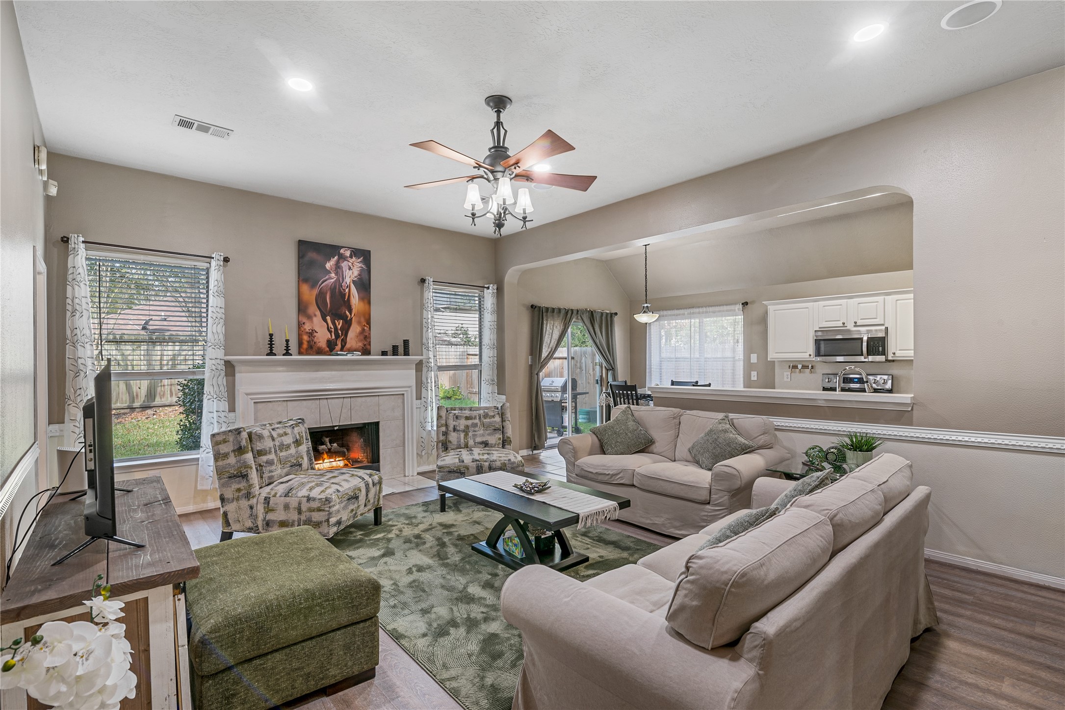 31203 Baker Lake Drive Spring, TX 77386 - Photo 8 of 24 Additional view of the open-concept layout showcasing the seamless connection between the living area and the kitchen, creating and ideal space for everyday livng and effortless entertaining.