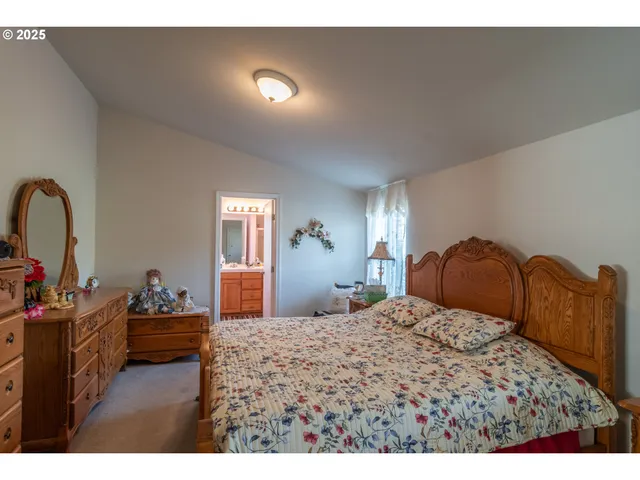 a bathroom with a sink vanity and mirror